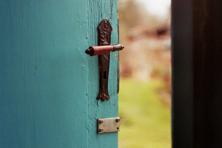 Old door latch representing opening up and feeling safe in counselling”